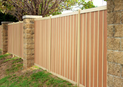 Wood & Metal Privacy Fence With Stone Posts