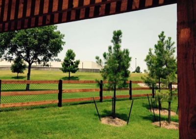 FenceTrac Cedar Ranch Rail Fence on Metal Posts With Chainlink