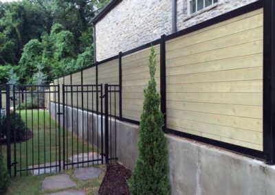 FenceTrac Privacy Fence on Retaining Wall