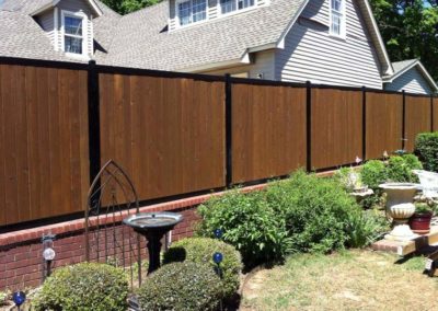 FenceTrac Privacy Fence on Brick Wall