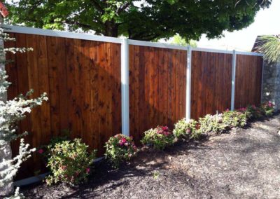 FenceTrac Stained Wood Fence With White Metal Posts