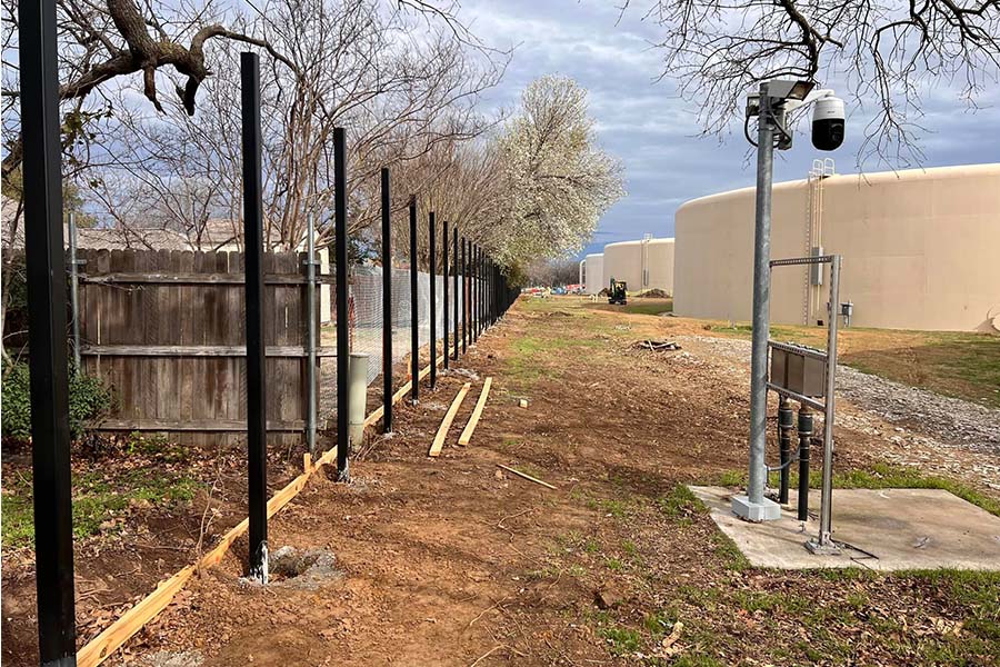 Black Metal Fence Posts in Concrete