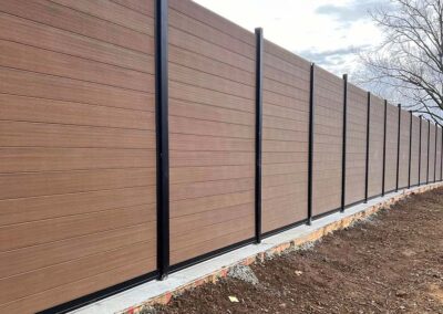 8-Foot Horizontal Composite Metal Fence Teak Under Construction