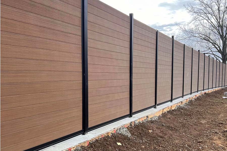 8-Foot Horizontal Composite Metal Fence Teak Under Construction