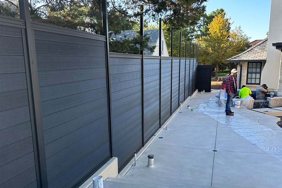 Black LuxeCore Composite Horizontal Fence Under Construction