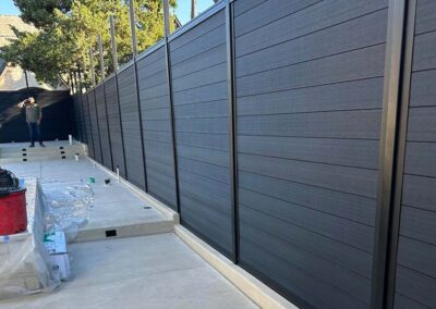 Black LuxeCore Composite Horizontal Fence Under Construction