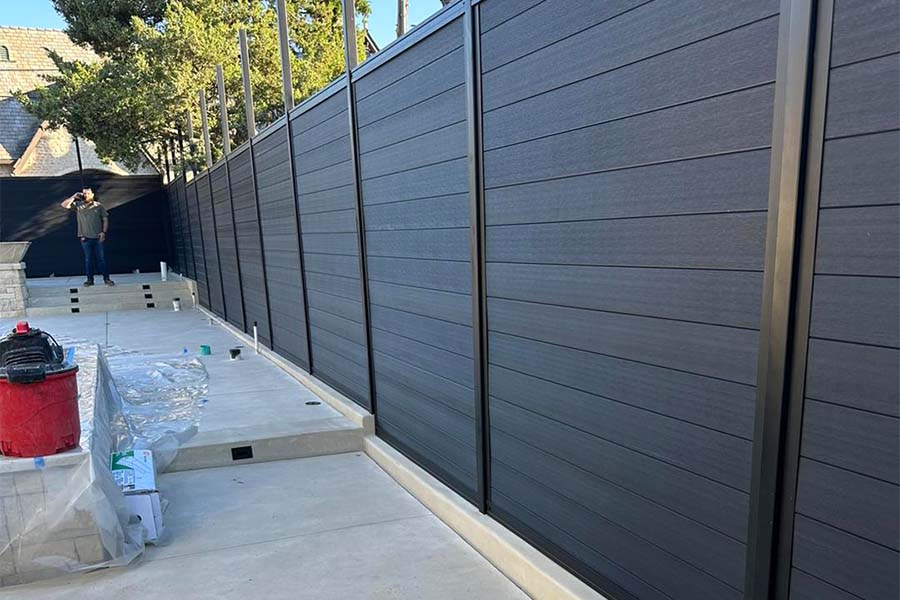 Black LuxeCore Composite Horizontal Fence Under Construction