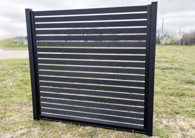 Black LuxeCore Composite Horizontal Slat Fence in Black Metal Frame