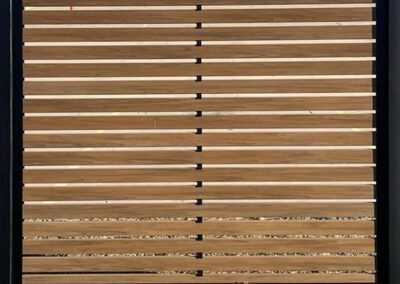 Teak LuxeCore Composite Horizontal Slat Fence in Black Metal Frame